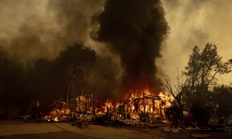 Flames consume a house near Old Oregon Trail as the Fawn fire burns north of Redding in Shasta county, California, on 23 September. 