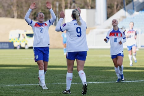 England's Alessia Russo, center, celebrates after scoring with England's Lucy Bronze, left, and England's Laura Blindkilde Brown.