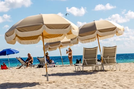 Umbrellas, beach chairs, and people on the beach