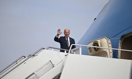 A serious-faced US president Joe Biden waves while boarding Air Force One at Joint Base Andrews in Maryland today, en route to Michigan.