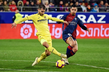 Huesca’s Ezequiel Avila keeps tabs on Manu Trigueros.