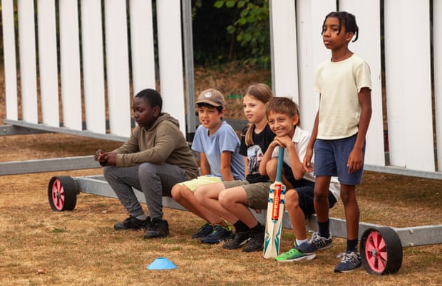 Youngsters watching a match during Catford & Cyphers Cricket Club's summer cricket camp