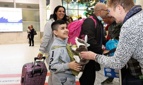 Ten-year-old George arrives at Sydney airport with his family