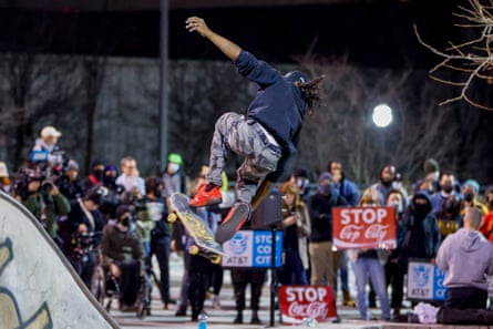 Dimitri Crippen rides his skateboard as a group of people protest over Tyre Nichols’ death at the Old Fourth Ward Skatepark in Atlanta last month.