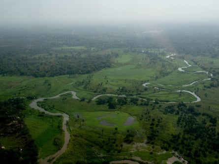 Aerial view of a river snaking through green countryside