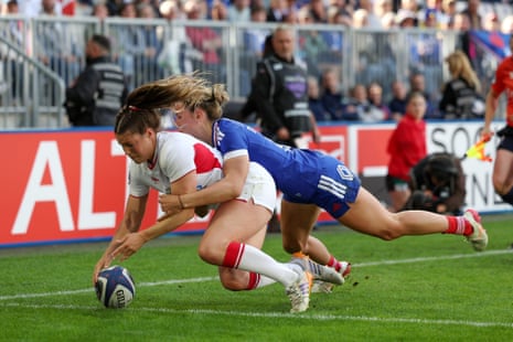 Jess Breach of England scores her team's third try.