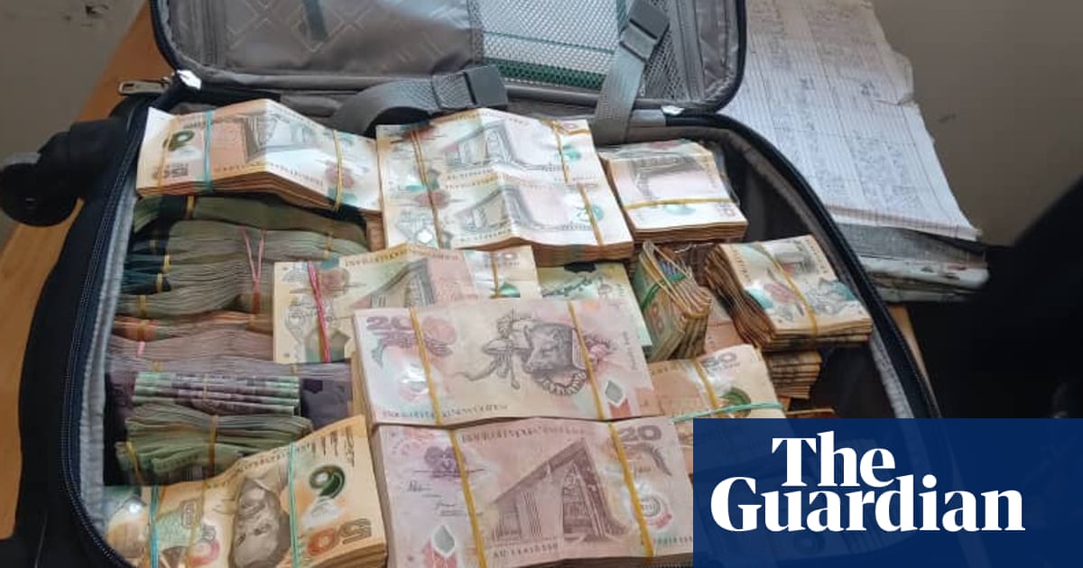 PNG prime minister denies connection to suitcase full of cash found as voting starts