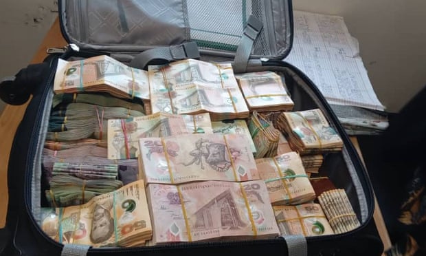 A suitcase containing 1.56m kina (AU$650,000) was found by police, but no charges were laid.