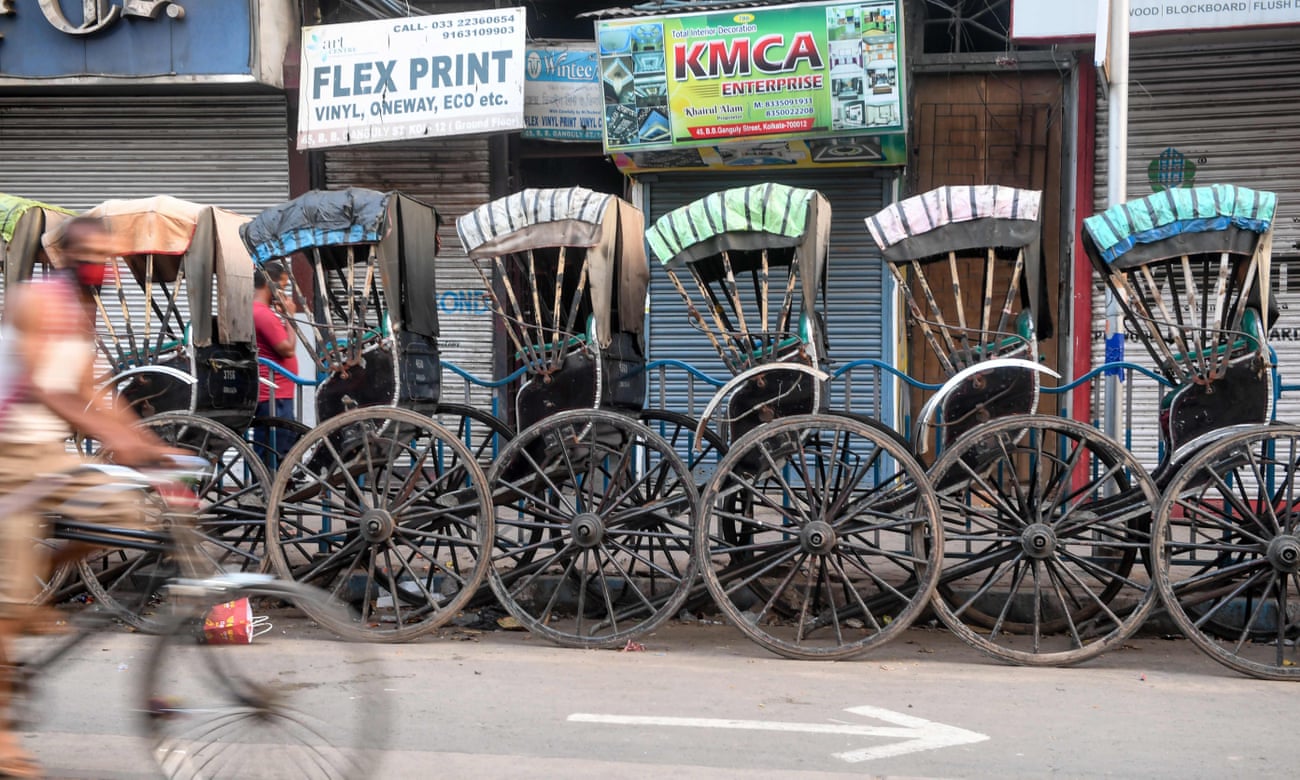 Rickshaws parked on a Kolkata roadside on the first day of India’s coronavirus lockdown