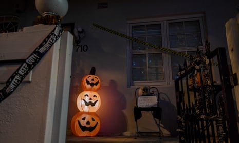 Halloween decorations outside a home, with a sign saying 'sorry we're all out of treats.'