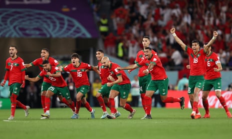 Morocco players celebrate their victory after the penalty shootout .