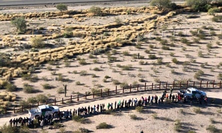 Migrants, apprehended after illegally crossing along the US-Mexico border in Arizona are lined up. Scott Daniel Warren faced charges for providing migrants with water, food and lodging.