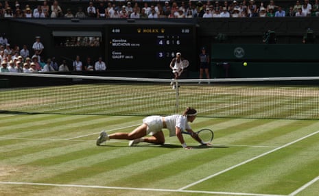 Karolina Muchova falls after hitting a return.