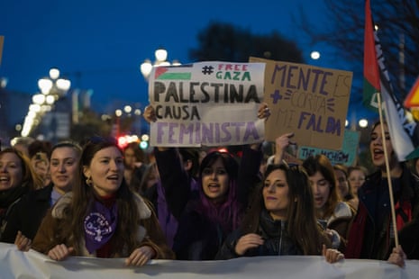 A banner displaying the slogan ‘free Gaza, Palestine cause feminist’ is held by demonstrators who marched through the streets of Santander, Spain, on Friday.