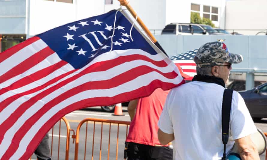 A Three Percenter protester attends a Maga and QAnon Rally in Los Angeles on 3 October 2020.