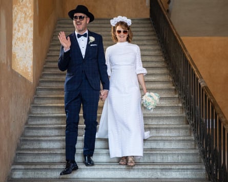 Nicola, wearing her secondhand wedding dress, and her husband on their wedding day.