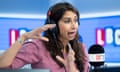 Suella Braverman wearing a headset in an LBC studio with a microphone in front of her.