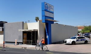 Phoenix Police block the entrance outside the Arizona Democratic Party headquarters following the 24 July fire