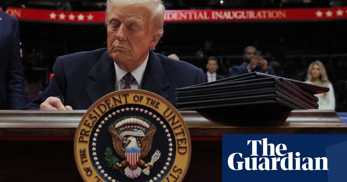 Trump signs order to withdraw US from Paris climate agreement for second time | Trump administration Trump signs order to withdraw US from Paris climate agreement for second time | Trump administration