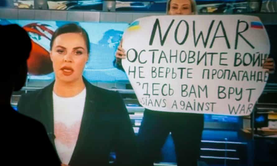 Marina Ovsyannikova interrupts Russian state news programme with sign saying: ‘Don’t believe the propaganda. You are being lied to here’ on 15 March.