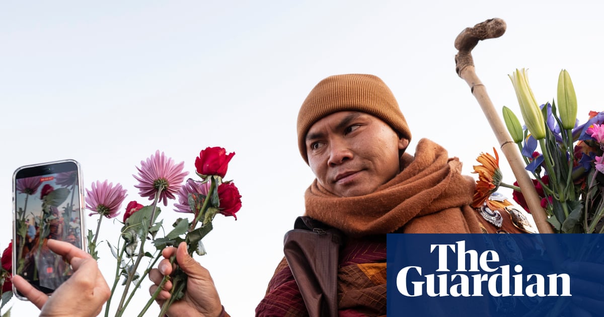 Monks attempt the radical, dangerous act of promoting kindness in Trump’s America while everyone else copes by buying $20 T‑shirts and doomscrolling.