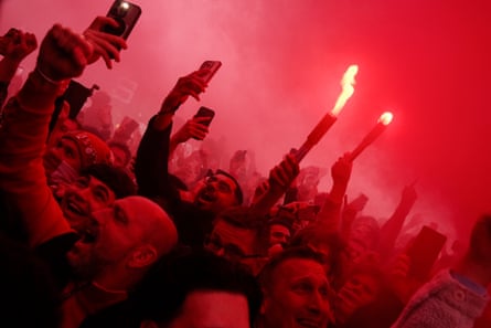 Arsenal fans let off red flares outside the Emirates Stadium before the semi-final, second leg