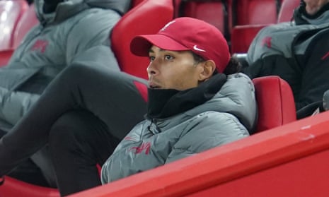 Virgil van Dijk is pictured in the stands watching Liverpool v Wolves last December