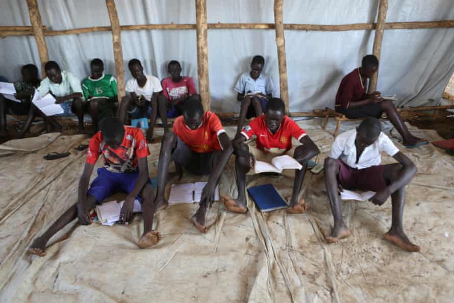 Youth who fled fighting in South Sudan attend classes in a tent at Bidi Bidi refugee?s resettlement camp near the border with South Sudan, in Yumbe district, northern Uganda December 7, 2016. REUTERS/James Akena