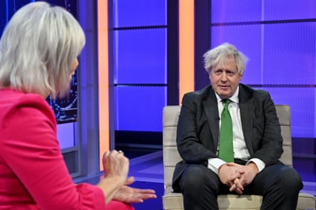 The former culture secretary Nadine Dorries interviews the former prime minister Boris Johnson on the first episode of her new talk show, ‘Friday Night with Nadine’, on TalkTV.