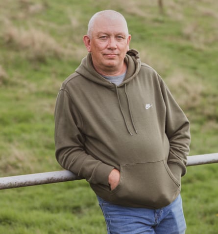 Lee Bridgeman, a Labour councillor in east Carditt, in green hoodie and jeans, leaning against a railing