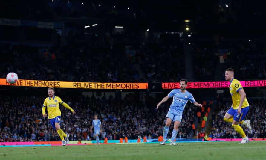 Manchester City’s Bernardo Silva scores their third goal.