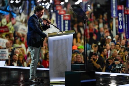 man speaks behind podium