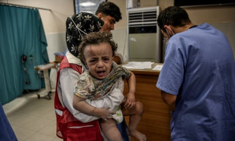 A Palestinian child is brought to Nasser Hospital after an Israeli attack on Khan Yunis, Gaza on Monday.