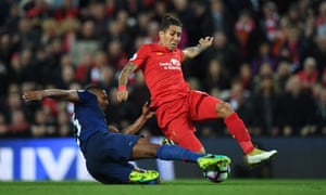 Roberto Firmino is denied by Antonio Valencia.