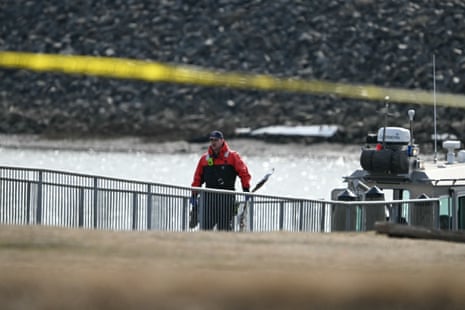 Investigators carry pieces of wreckage Investigators carry pieces of wreckage