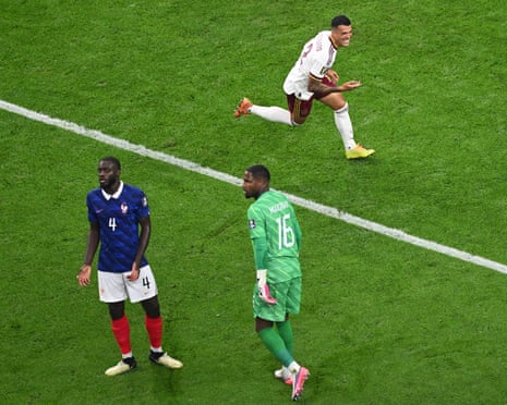 Pedro Porro turns to celebrate making it 2-0 as Mike Maignan and Dayot Upamecano despair.