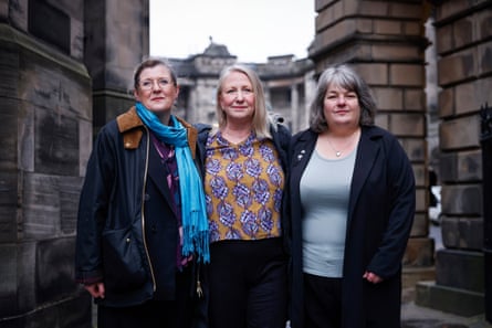 Three women in coats and scarves