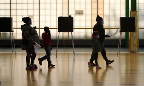 Voters cast their ballots in Cleveland on 3 November.
