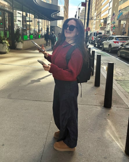 a woman in a red sweater
