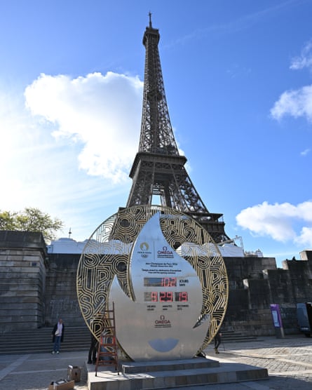 Structure shaped like a flame carries digital clock showing time to go until the games begin