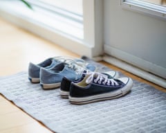 Canvas shoes in doorway of house