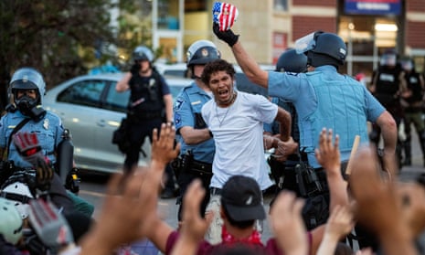 Minneapolis police detain a man during protests over the death of George Floyd. The Minneapolis council president said efforts to reform the police department have not been successful.