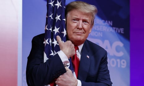 Donald Trump hugs the American flag