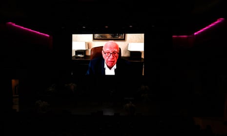 Rupert Murdoch speaking on the big screen during the State Memorial Service for Australian comedian and actor Barry Humphries at the Sydney Opera House in Sydney, Friday, December 15, 2023.