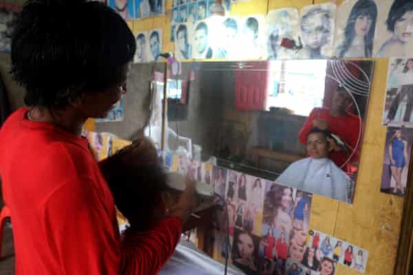HIV patient José Roca in his hair salon in Tamshiyacu.