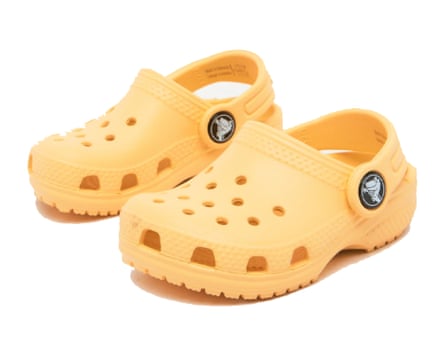 A pair of Crocs Classic Clog Toddler in Pale Yellow