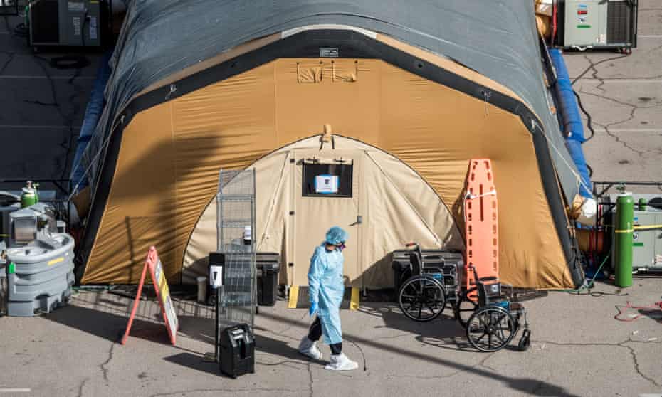 A nurse exits a tent for coronavirus patients at University Medical Center in El Paso, Texas. 