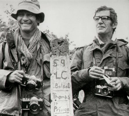 AP photographer Henri Huet, left, and Life magazine’s Larry Burrows are seen in February 1971 at the Vietnam-Laos border near Ben Het. They were killed along with two others when the helicopter they were in was shot down a few days later.