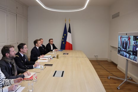 French president Emmanuel Macron attends the virtual summit held by Keir Starmer (on screen).