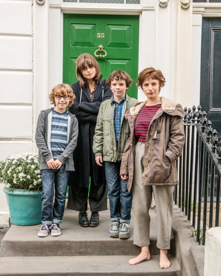Helena Bonham Carter, Faye Marsay, Ethan Rouse and Harry Webster standing on the doorstep of a Georgian terrace